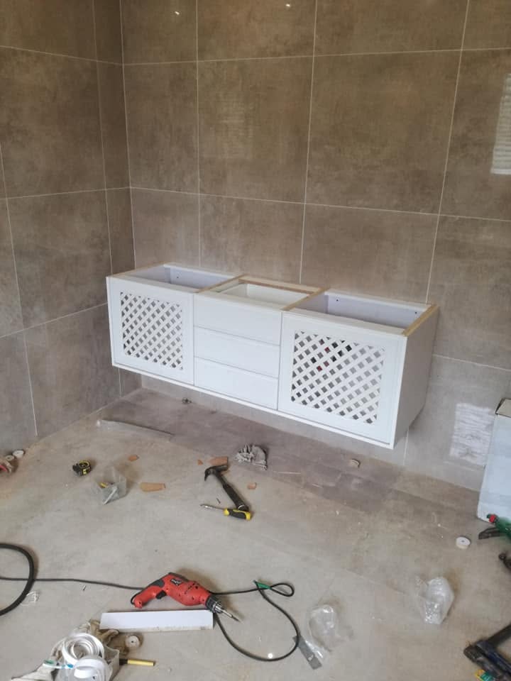 Built-in cabinetry during installation by PZN Designs
