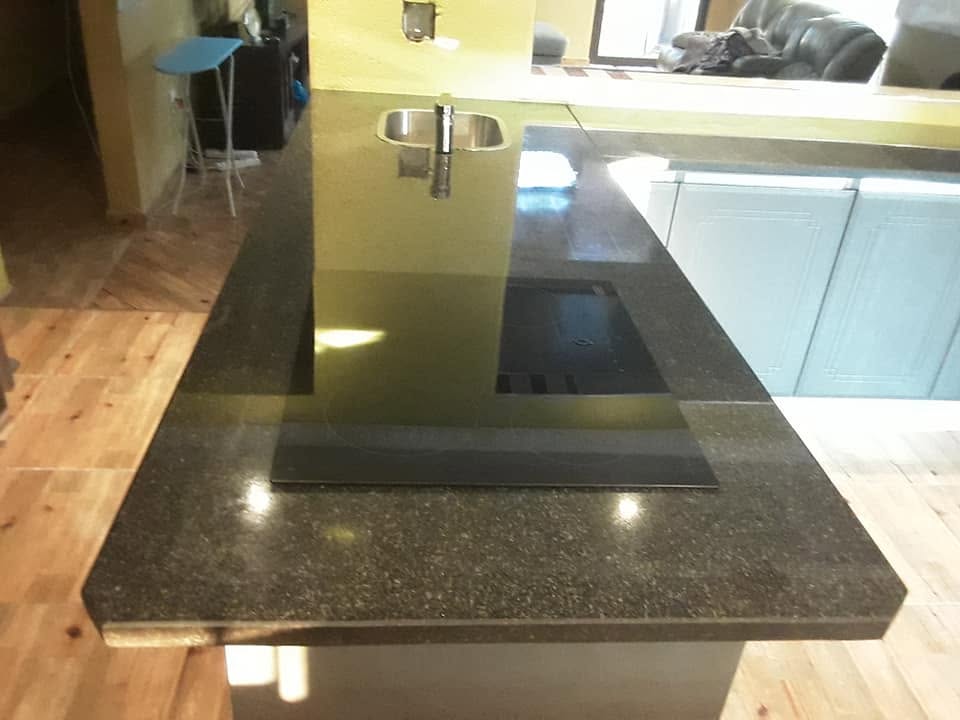 Luxury custom kitchen with stone island in a Bedfordview home by PZN Designs