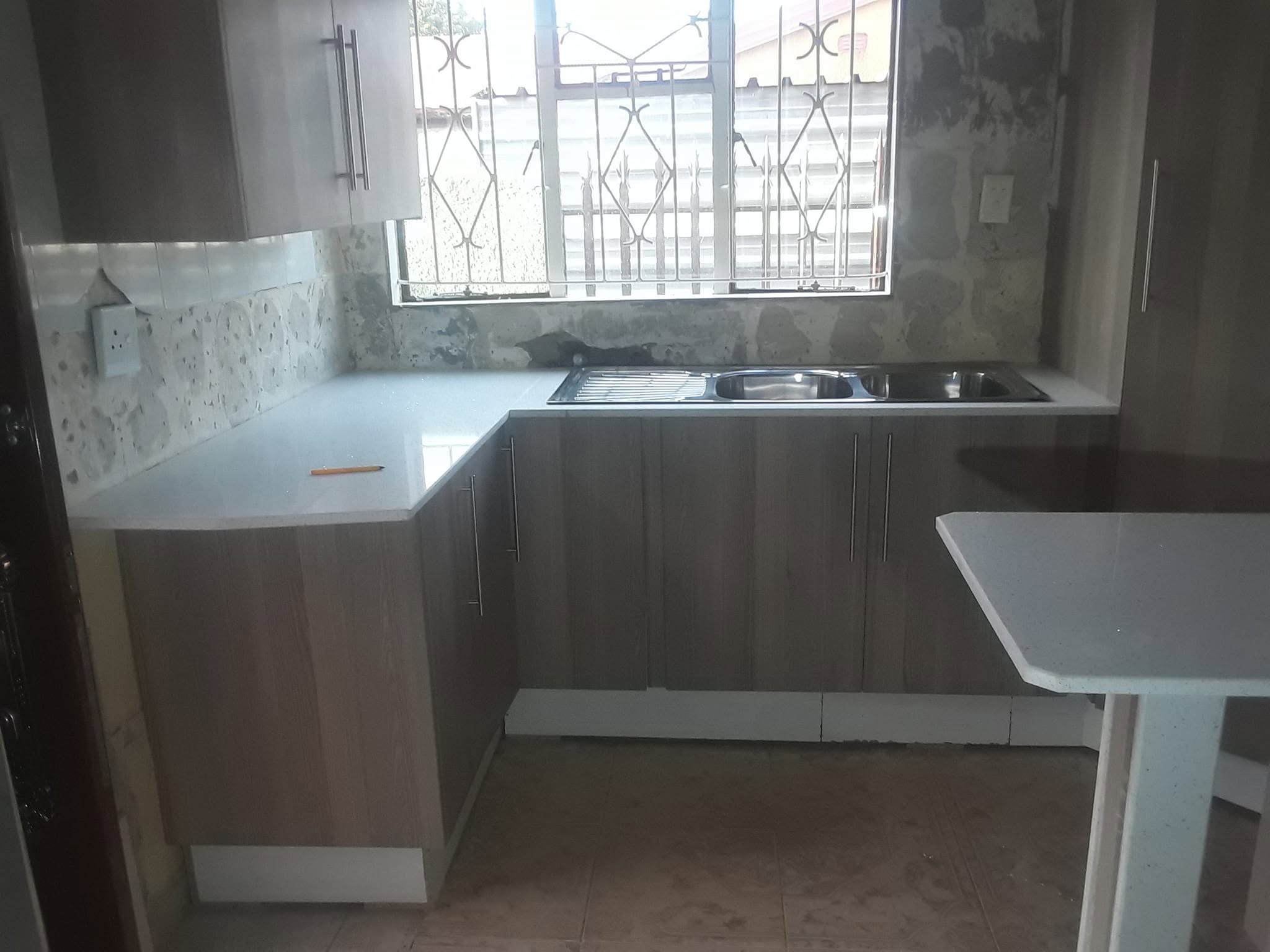 Consultation and measuring a client's kitchen space