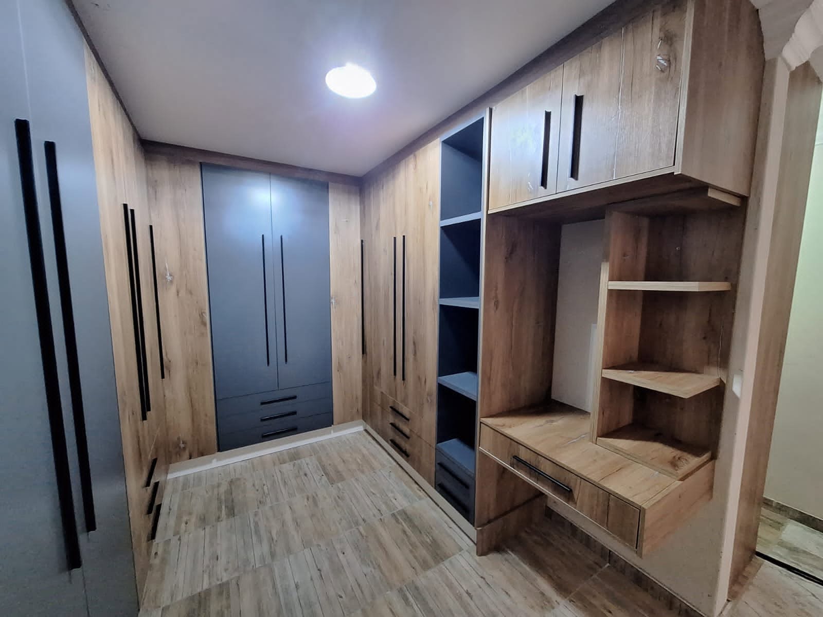Built-in wardrobe with oak and charcoal finish by PZN Designs